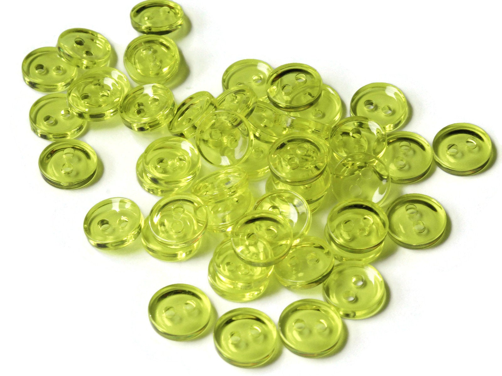 50 11mm Clear Light Yellow Flat Round Plastic Two Hole Buttons by Smileyboy | Michaels